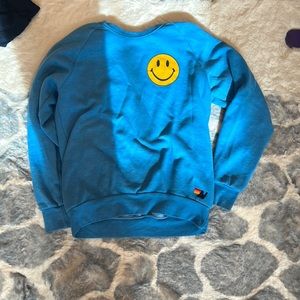 Blue Aviator Nation sweatshirt with smile face